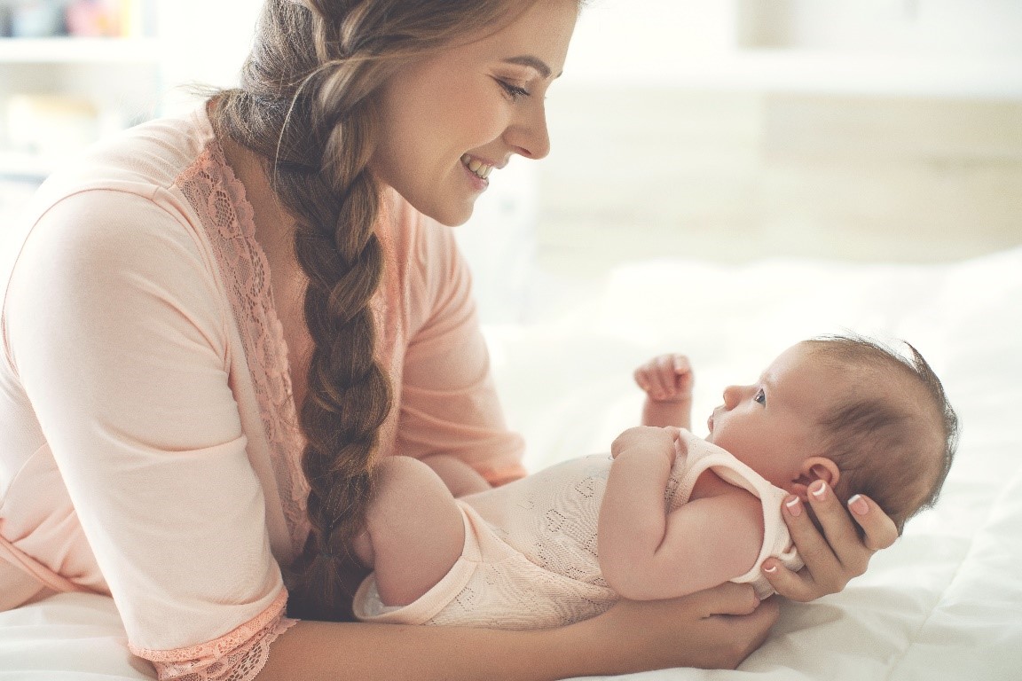 Mother holding her baby carefully